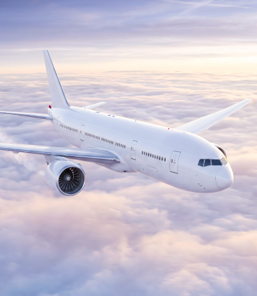 Passenger airplane flying above clouds